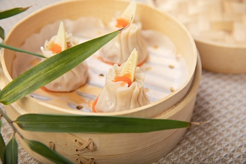 Assortment of dim sum in bamboo steamers