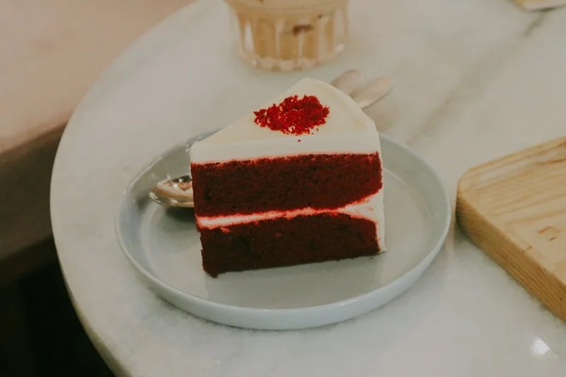Red velvet cake slice and turmeric latte