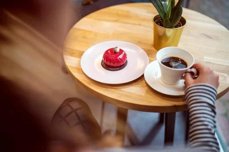 Friends enjoying sweet treats in a cozy cafe