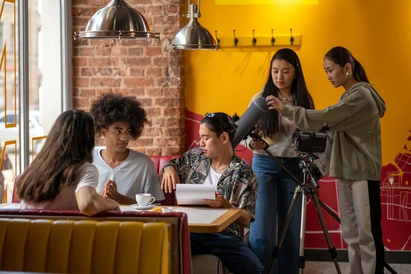 Diverse people working happily in a modern cafe