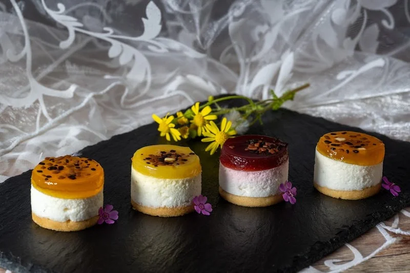 Assorted mini desserts platter with edible flowers