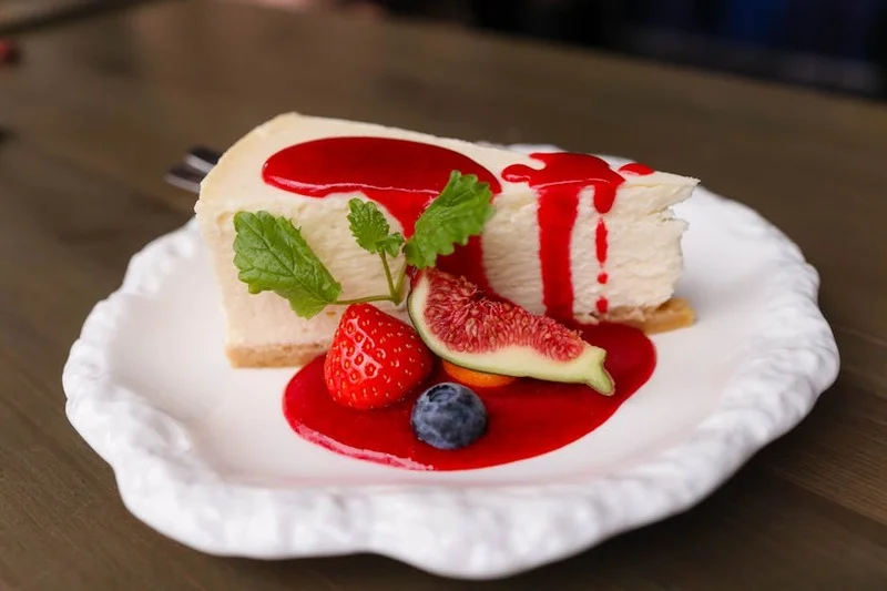 Deconstructed cheesecake with raspberry coulis